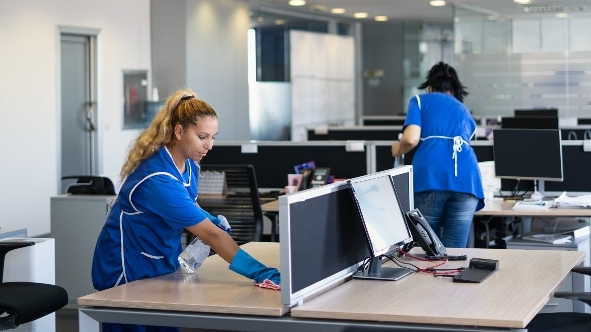 Cleaners clean empty office spaces jpg